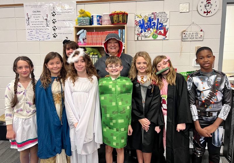 Mrs. Hatala and students dressed up for Halloween